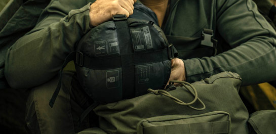Brytzky Tactical rolled outdoor gear pouch next to backpack